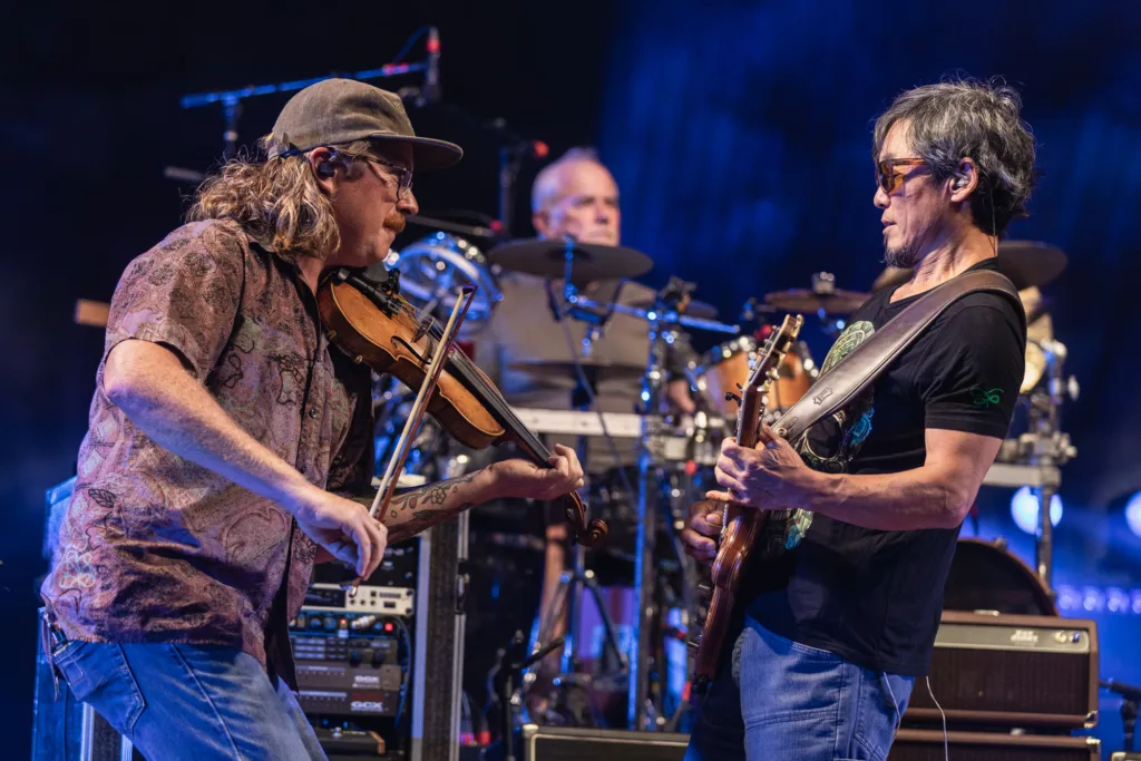 Dan Andree of Clay Street Unit with Michael Kang of The String Cheese Incident, July 17, 2026, Red Rocks Amphitheatre, Morrison, CO. Photo by Mitch Kline.